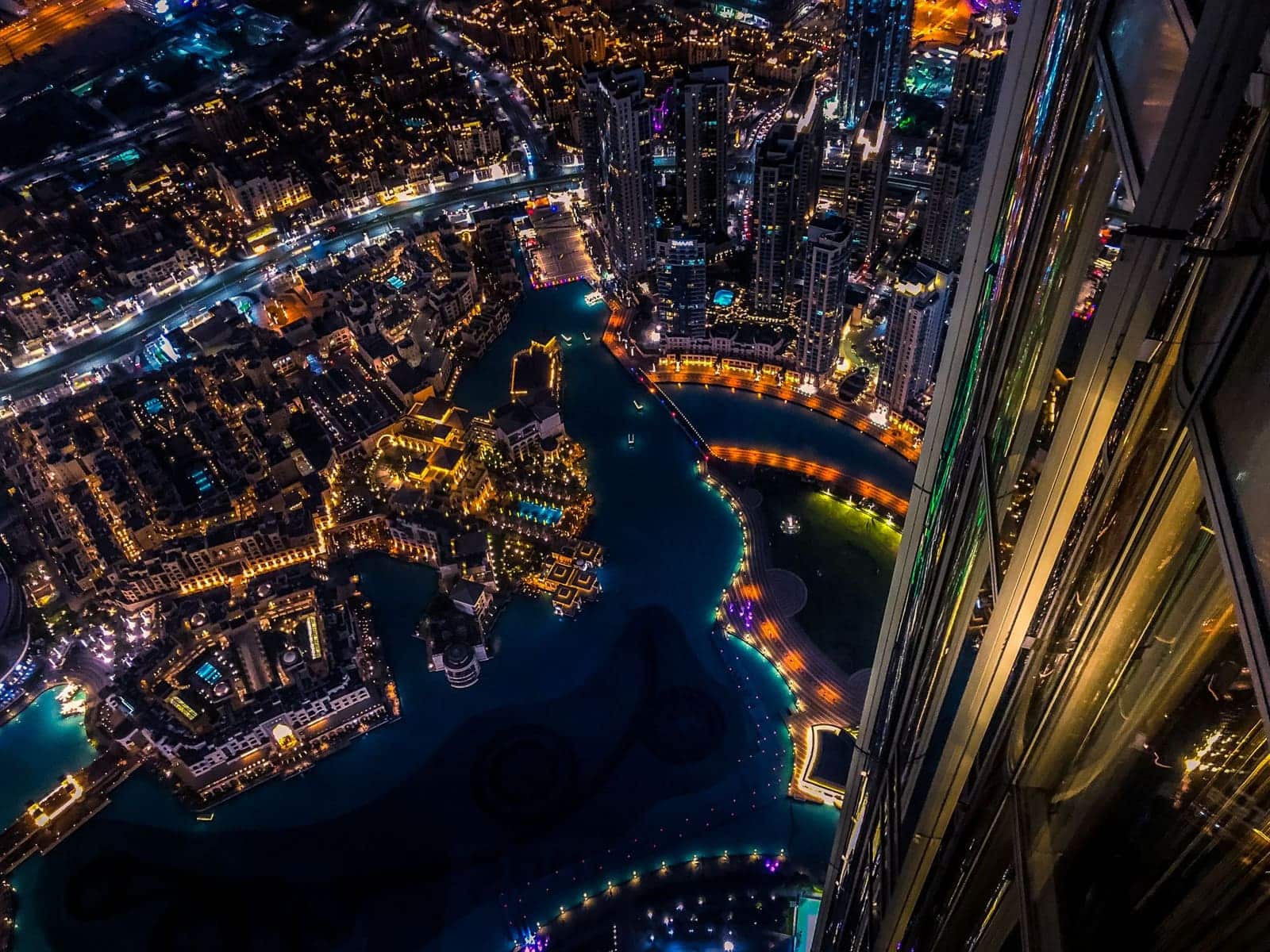 Aerial view over Dubai showing the city's coastline and layout from above